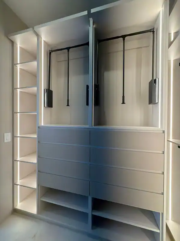 Closet elevation with two pull-down hanging rods above eight drawer fronts, an LED-lit shelf column at left and open shelves below